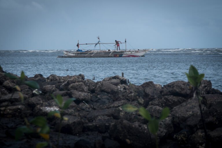 Fisherfolk in Panay, Capiz on a boat