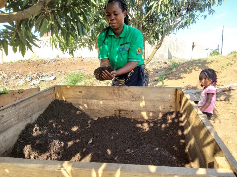 Daniela is harvesting vermicompost for the vegetable garden , transformed from organic waste and cattery manure into organic fertilizer by earthworms