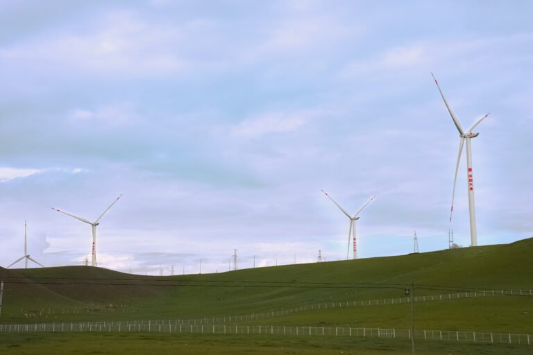 The windmills were turning slowly when the sky was getting dark.