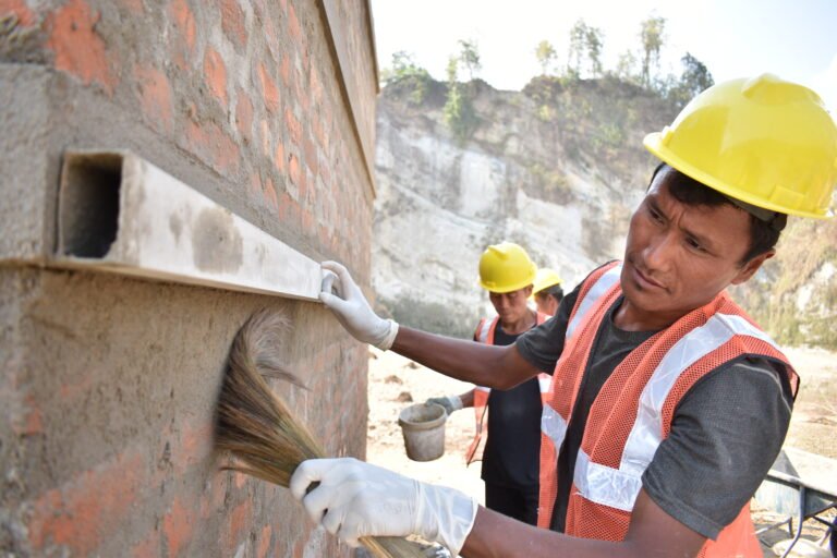 Aaita Sing Pakhrin, a trained mason at work with newly constructed house belonging to Jit Bahadur Thing a project participant. The house is located in Bakaiya-2 in  Nepal and it is built by "ReCoVER" project under the full construction house (FCH) scheme with Catholic Relief Services (CRS).
