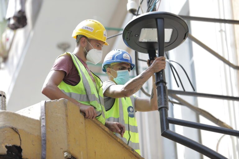 USAID/CSP worker installs environmentally friendly LED streetlights in damaged neighborhoods around the Beirut Port blast area – Beirut, Lebanon.
