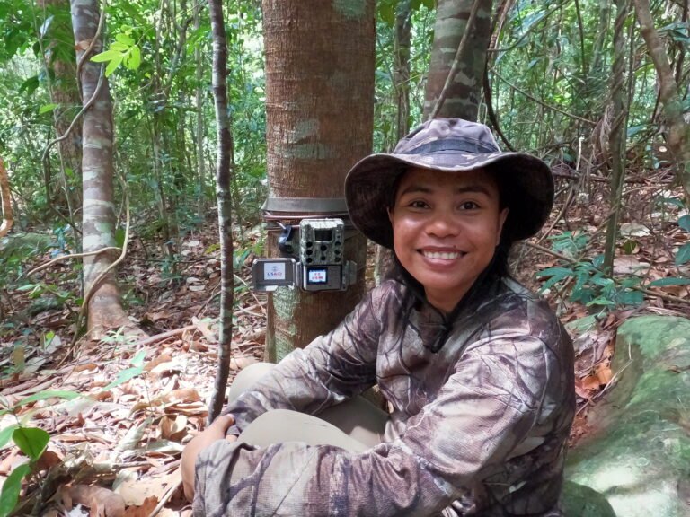 Ms. Ret Thaung deploys camera traps for biodiversity monitoring in the deep forest.