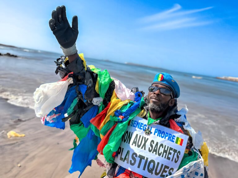 Modou Fall, an eco-warrior in Dakar, Senegal, dons his colorful cape made entirely of plastic bags he has collected from the sea. Mr. Fall, also known as "Plastic Man," is on a heroic quest to rid Senegal's capital of the pervasive plastic waste that plagues its waterways, beaches, and streets. Pinned to his chest is a sign boldly declaring "NO PLASTIC BAGS." In response to this pressing issue, the Senegalese government implemented a plastic product ban in 2020. However, enforcement remains a struggle, and