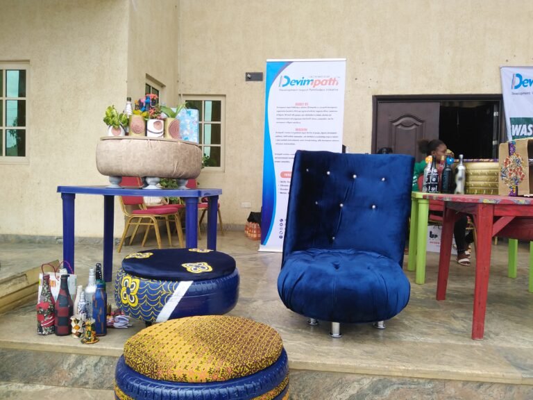 Upcycled furniture on display in front of a building.