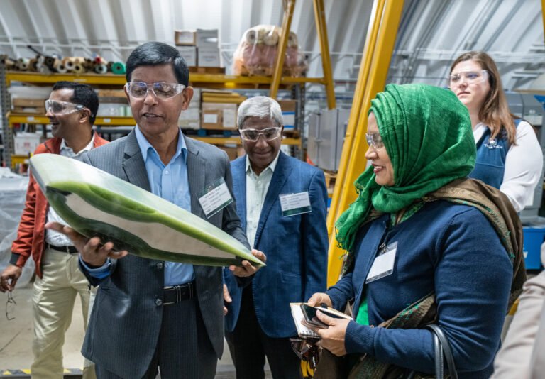 Partners from Bangladesh learning about water turbines.