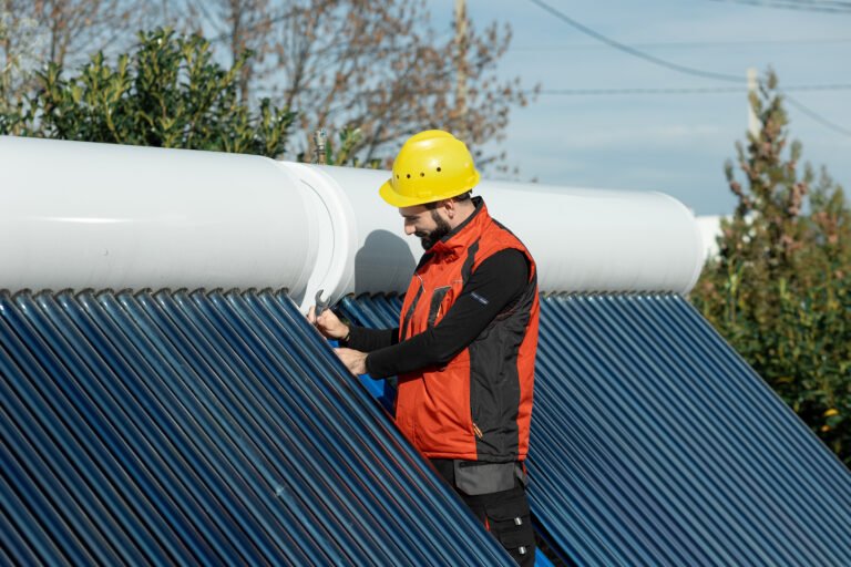 A man installing a solar collector
