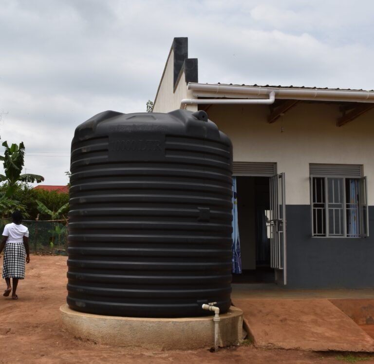 A large rainwater harvesting system in front of a building.