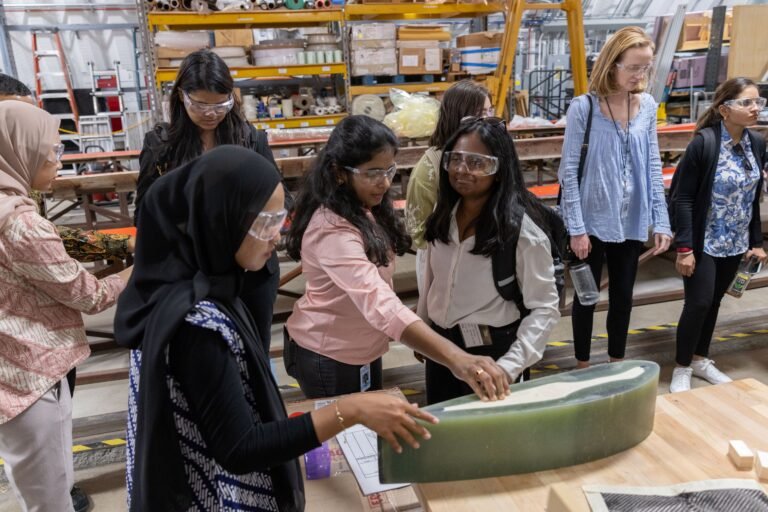 Interns learning about water turbines.