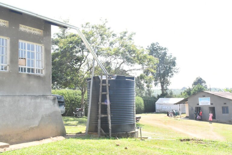 A large water tank outside of a maternity ward.