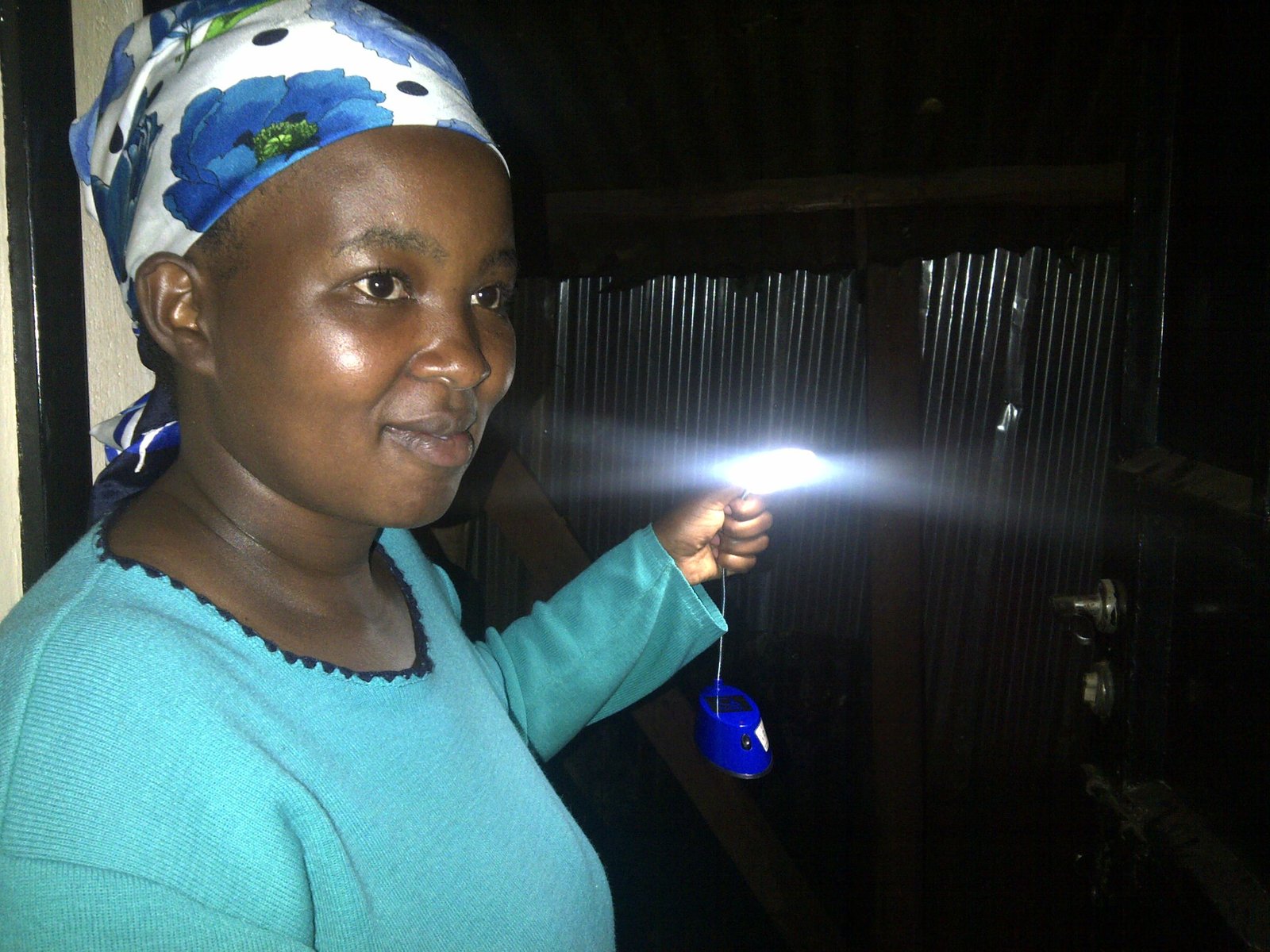 African mother checks her surroundings before retiring to bed