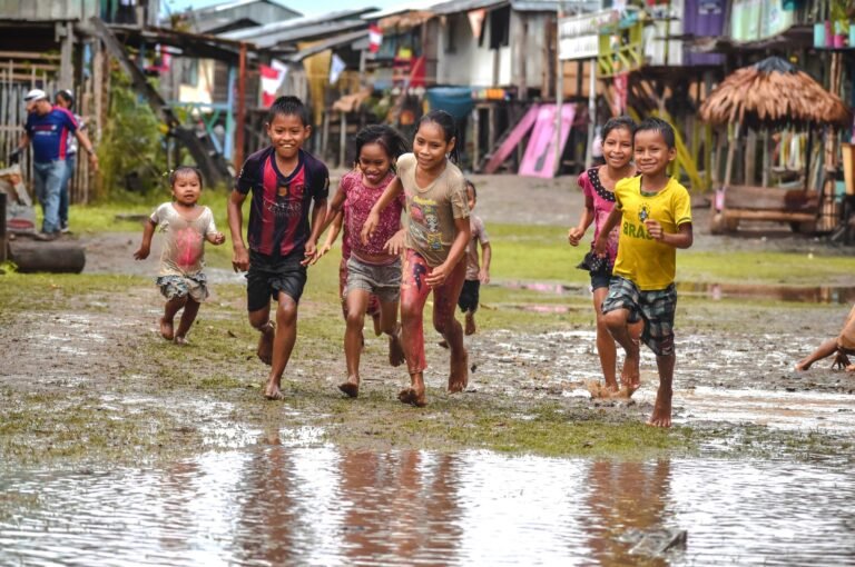 Children running in the rain