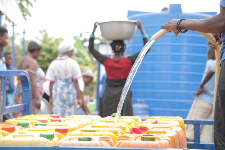 a primary school pupils in Kakamega County draw clean water from a well.