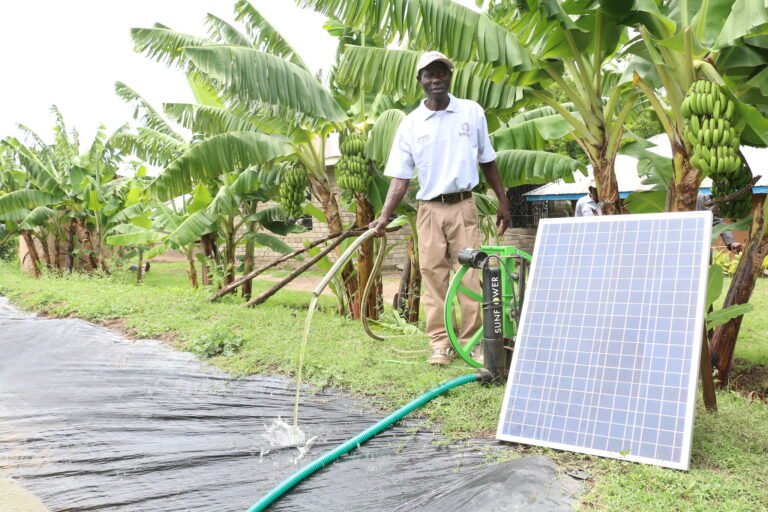 In photo: Joshua Okundi in Homa Bay County demonstrates usage of a solar pump.