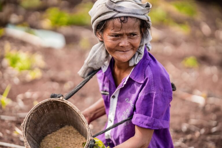 Women farmer sowing rice seeds in Palawan, Philippines