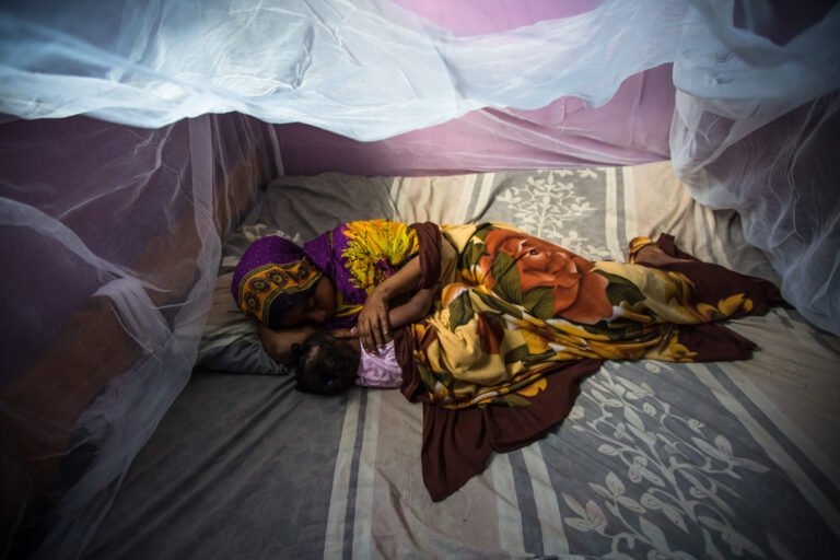Resting under the mosquito net