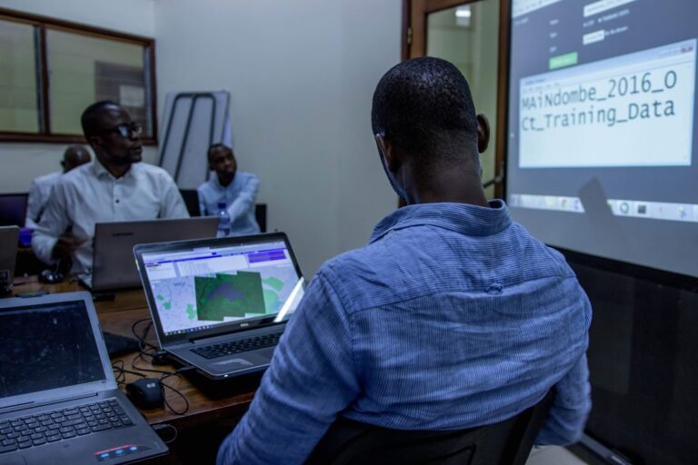 A trainee uses a computer in a classroom.