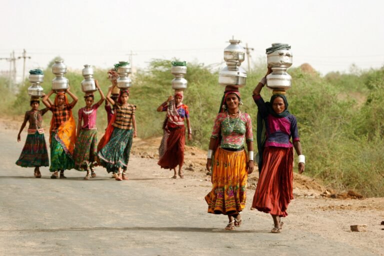 women carrying water in India